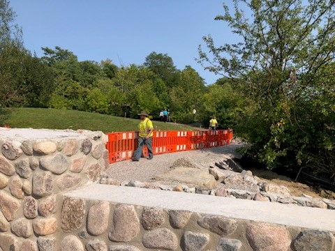 Workers and barricades by bridge