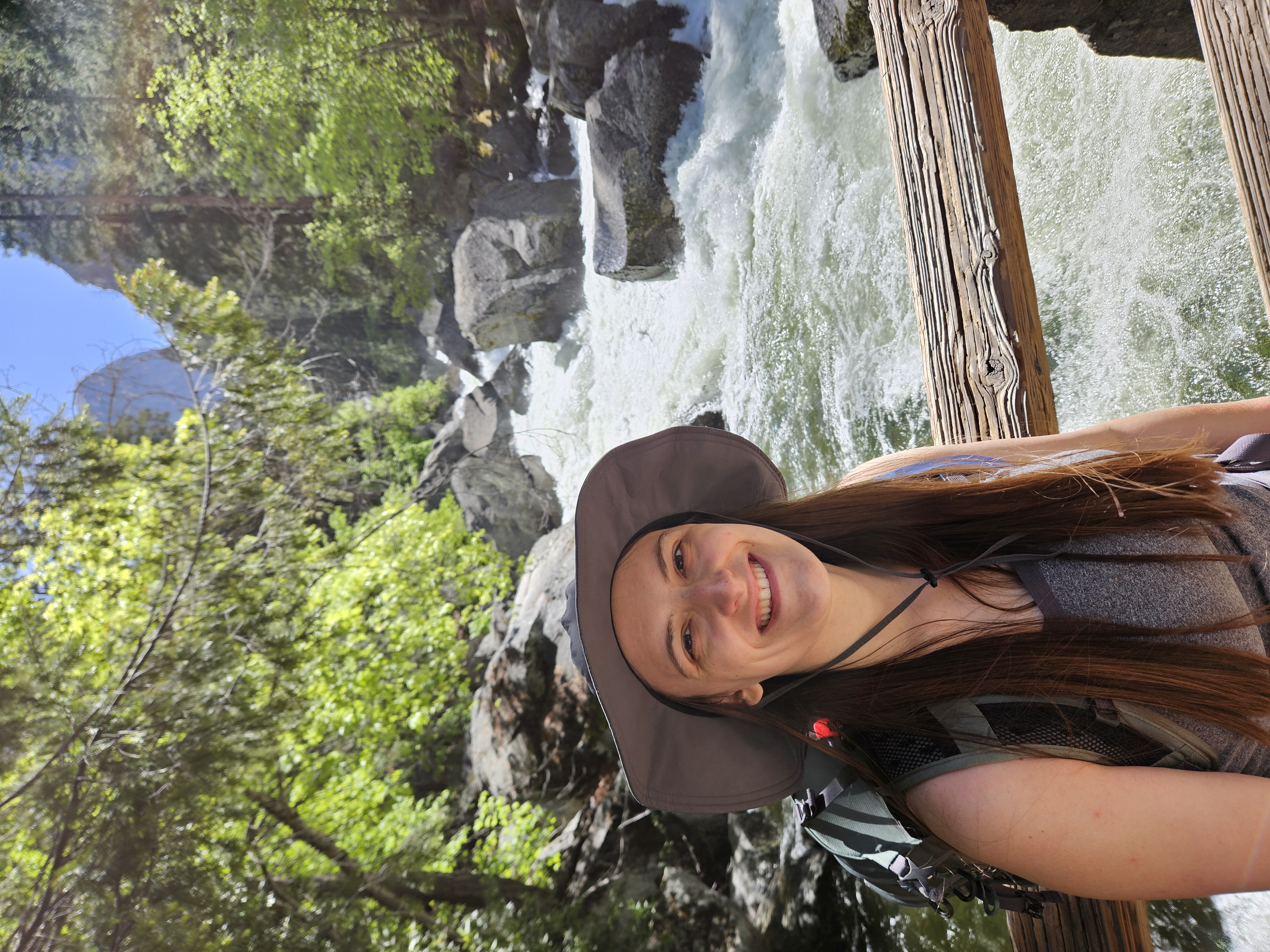 Photo of Carissa smiling next to a river