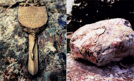 The commemorative plaque on "The Rock", now buried under paint